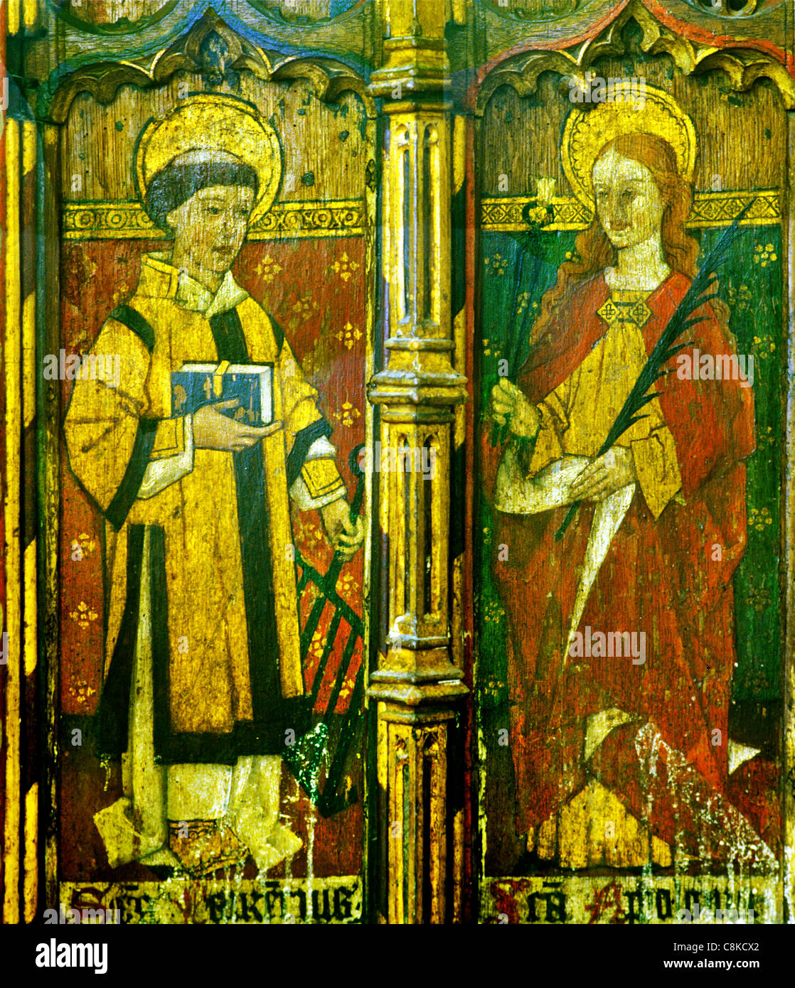 Ludham, Norfolk, rood screen, St. Laurence, Lawrence, holding a gridiron and St. Apollonia, holding pincers and tooth saints Stock Photo