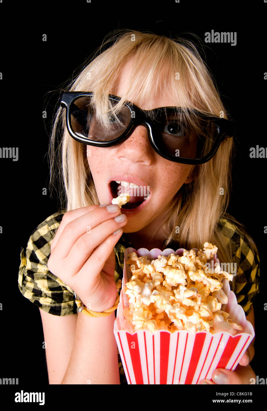 An Adorable Child Engrossed by a 3-D Movie Stock Photo