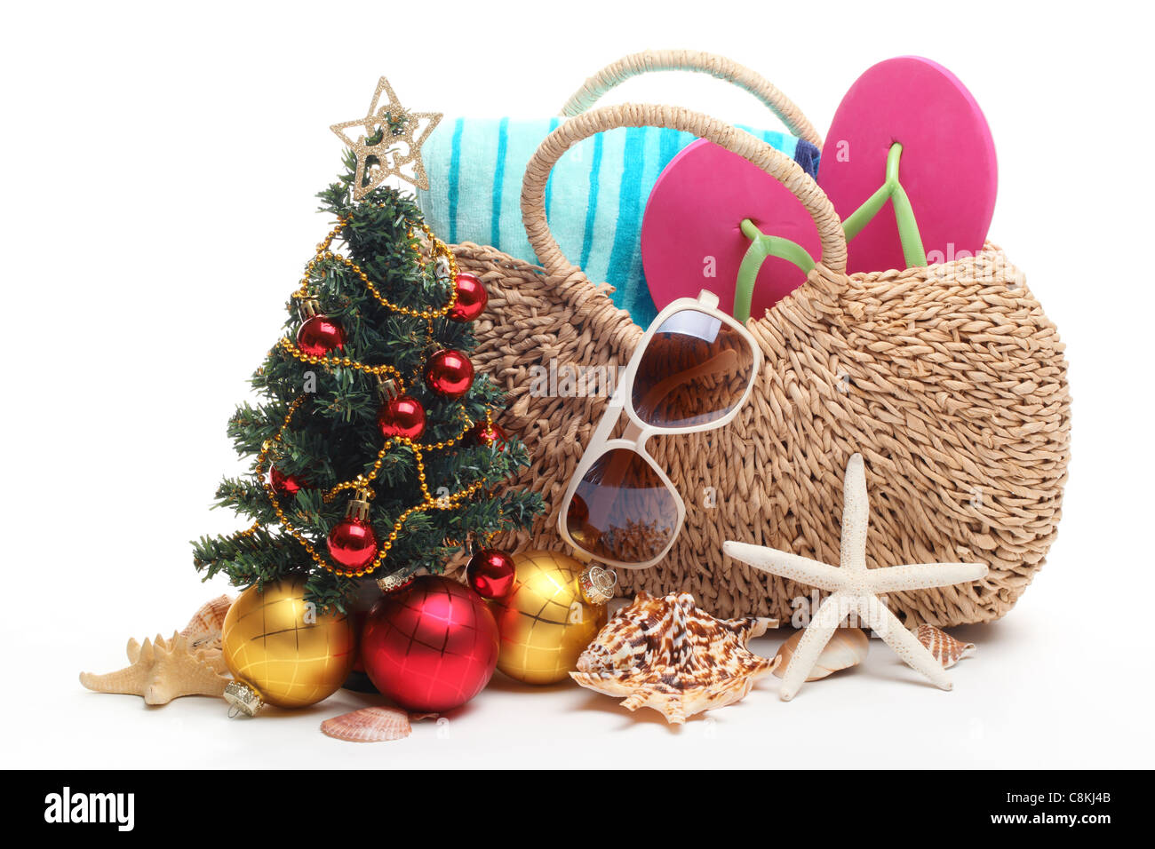 Beach accessories and Christmas tree on white background. Stock Photo