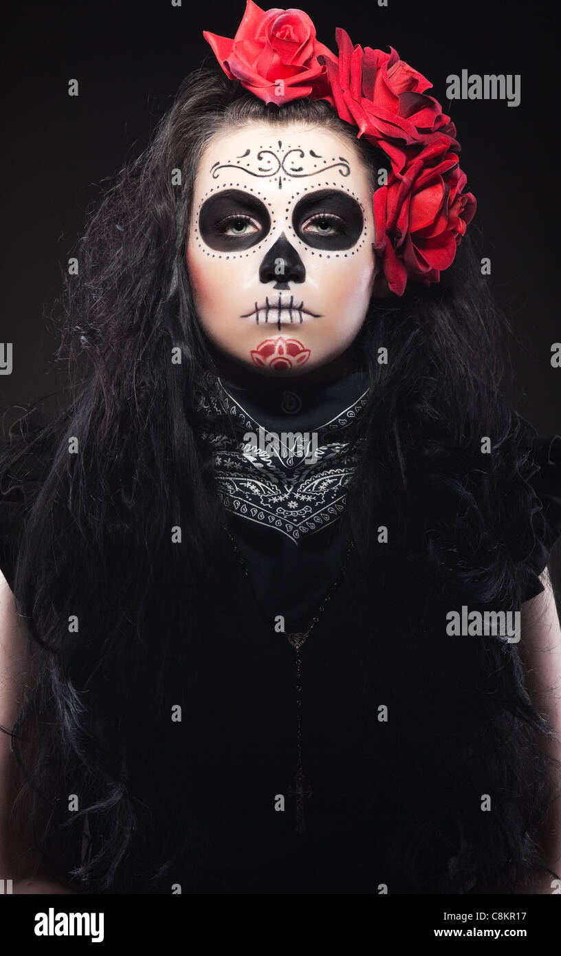 Serious woman in day of the skull mask Stock Photo Alamy