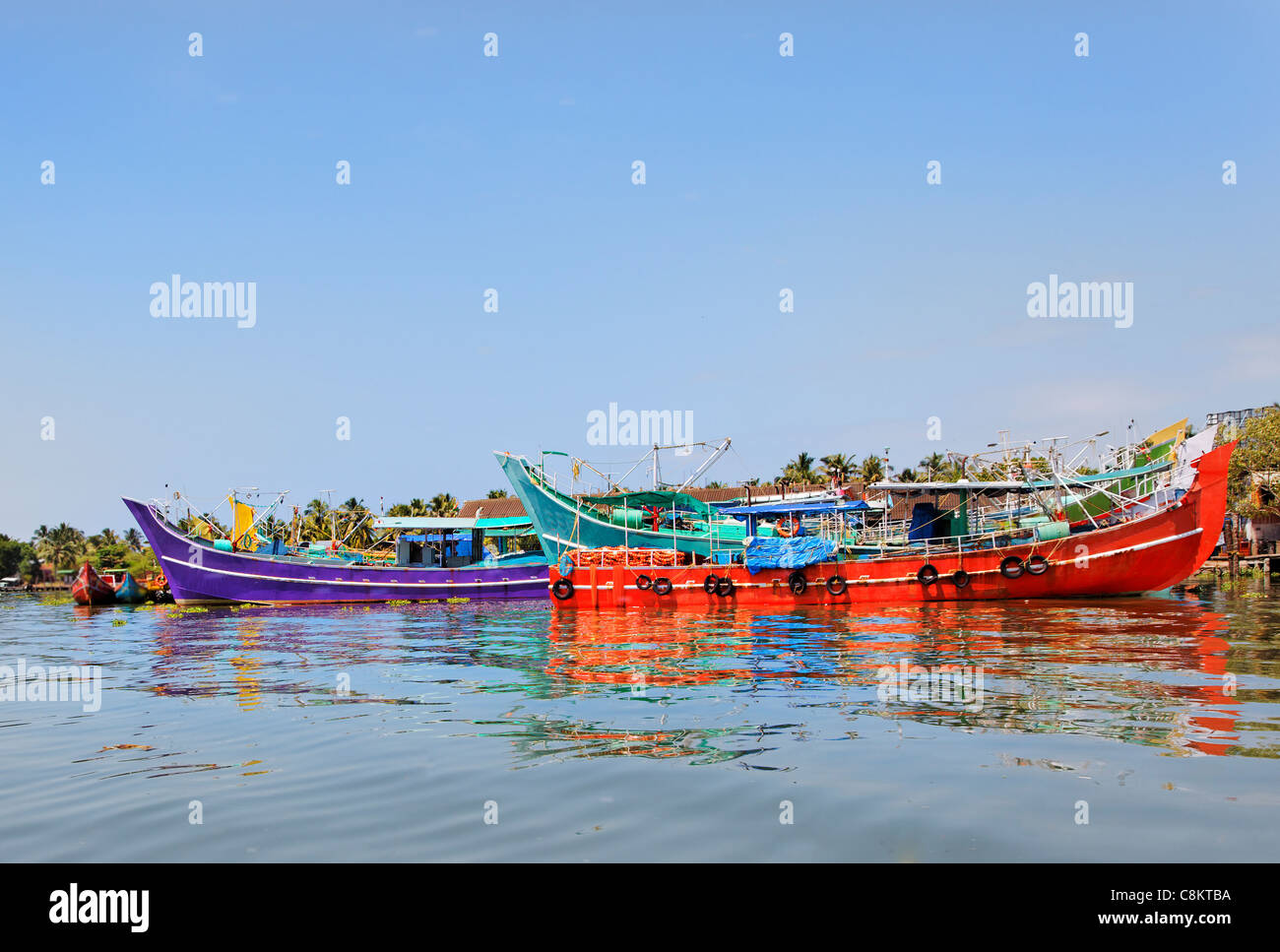 horizontal landscape colorful fishing boats moored Kochin backwaters Kerala India on way to boat races annual Paravoor Gothuruth Stock Photo