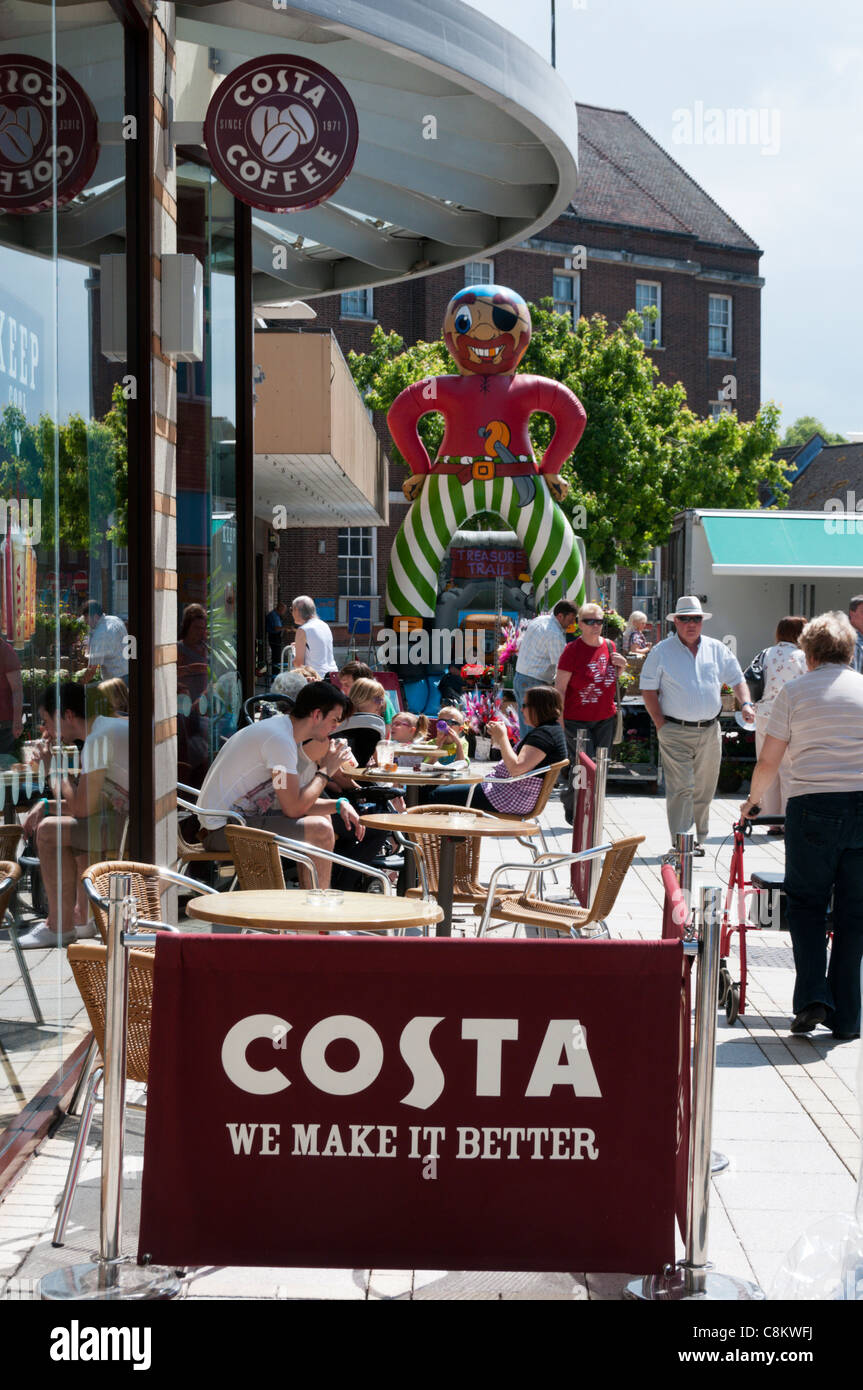A Costa coffee shop with people sitting outside in the town centre. Stock Photo