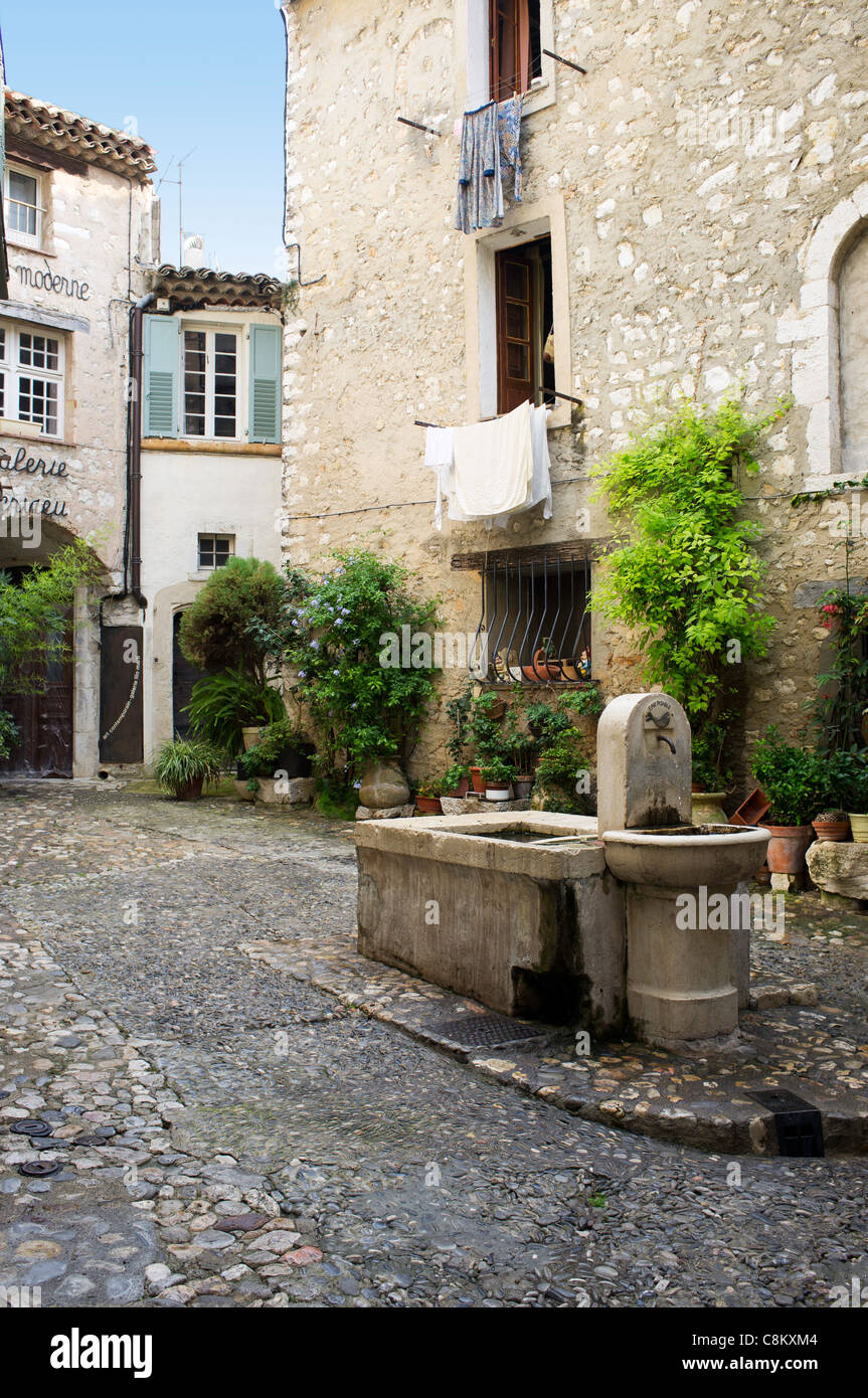 Water trough in a quiet courtyard in the ancient town of St Paul de Vence, Provence, France
