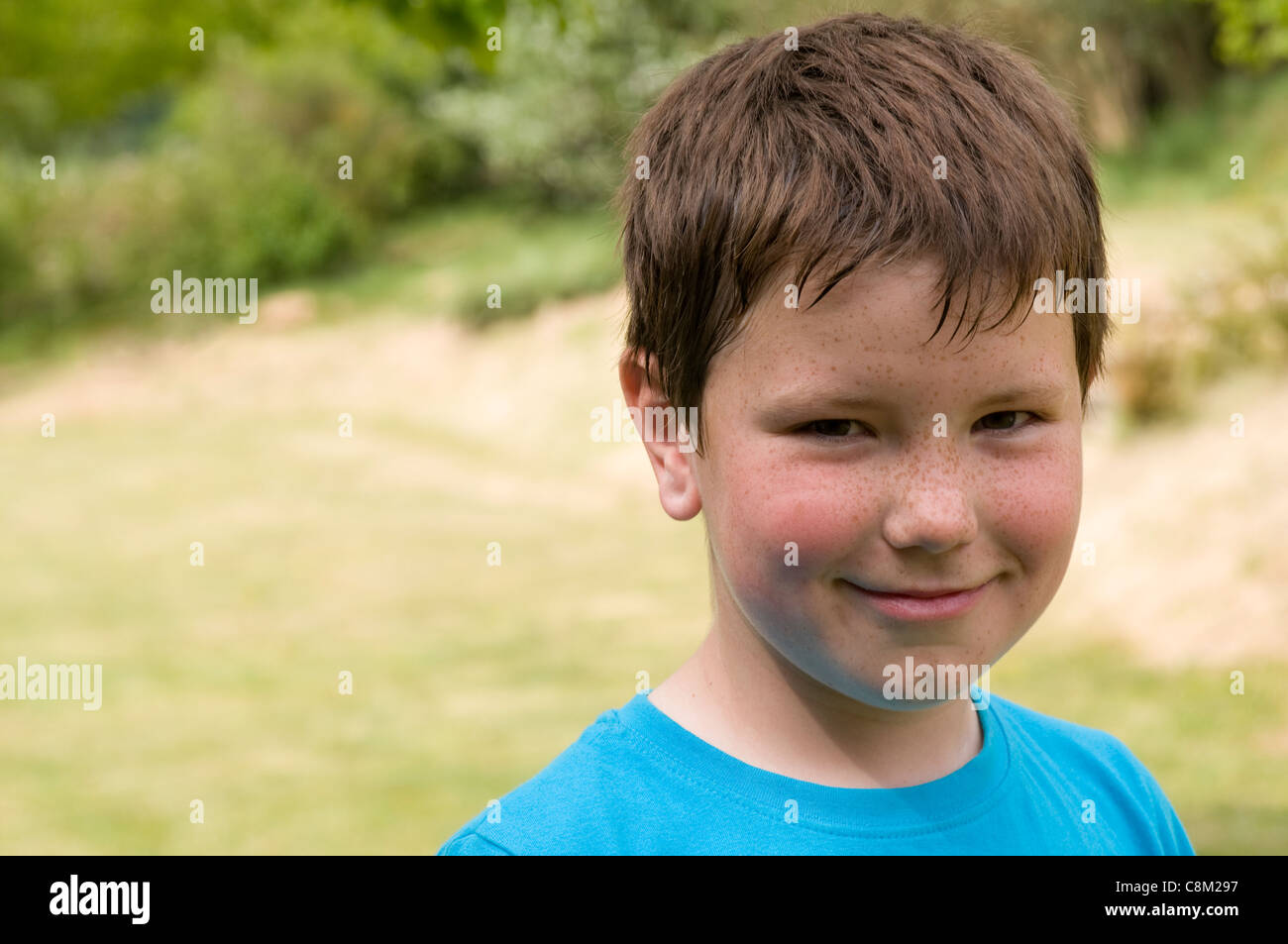 Head And Shoulders Portrait Of A Little Boy With Short Brown Hair