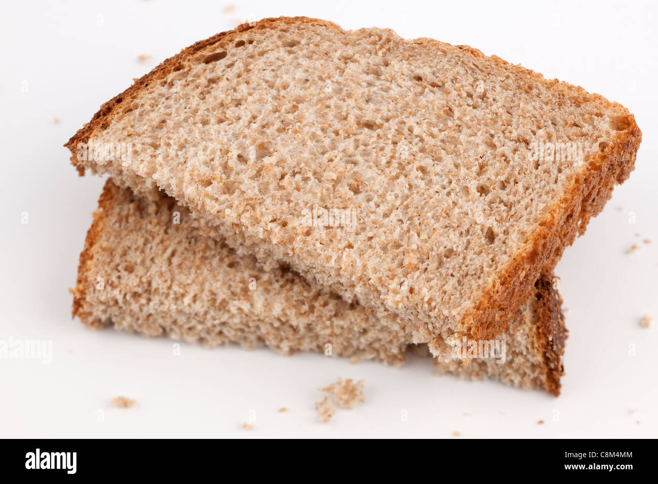 Halved wholemeal slice of bread Stock Photo Alamy