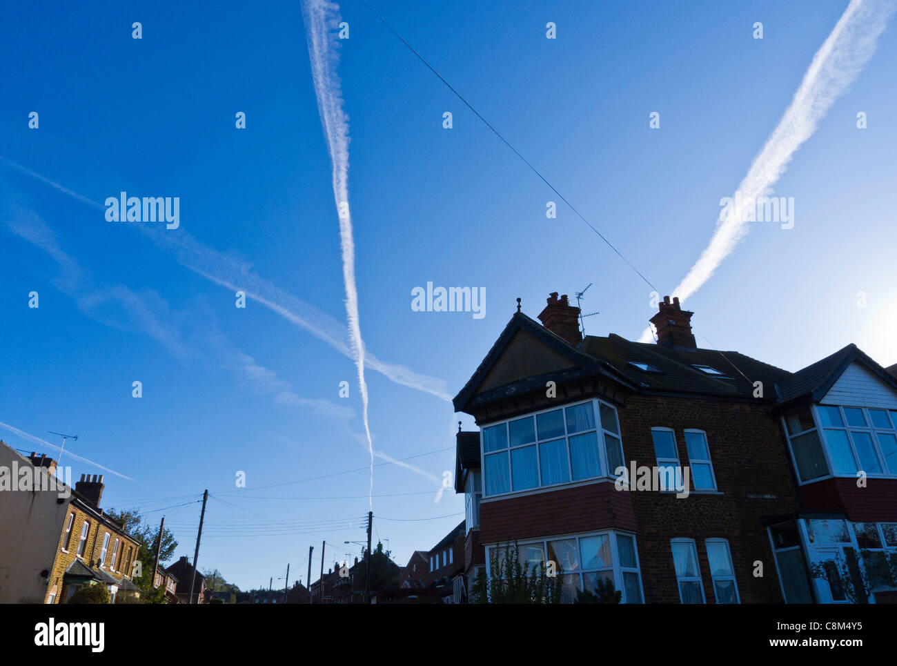 Contrails in the clear morning sky over Hunstanton, Norfolk, England. Stock Photo
