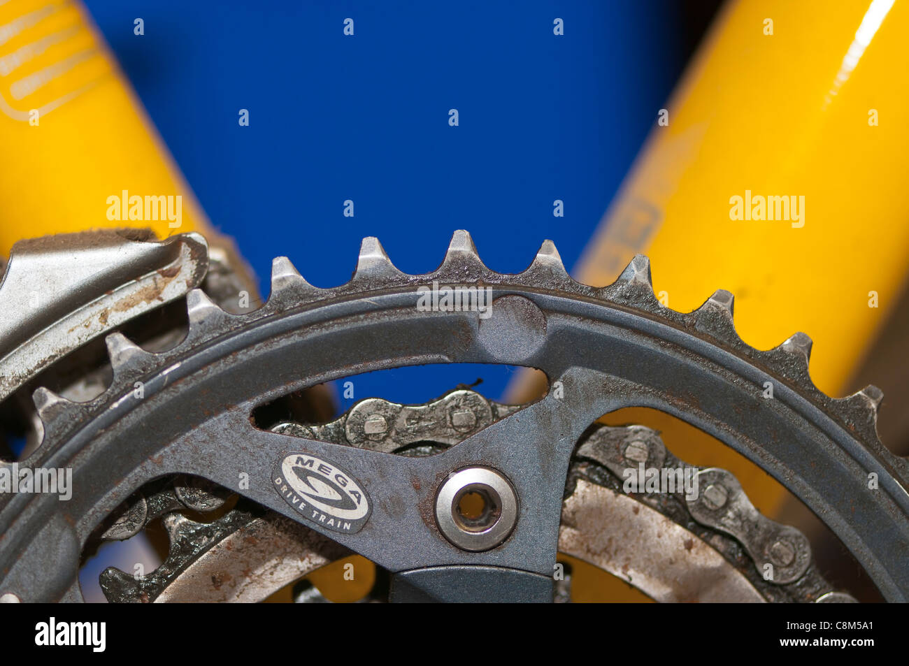 The front chainwheels (cogs) and chain on a bicycle derailleur  gear set. Stock Photo