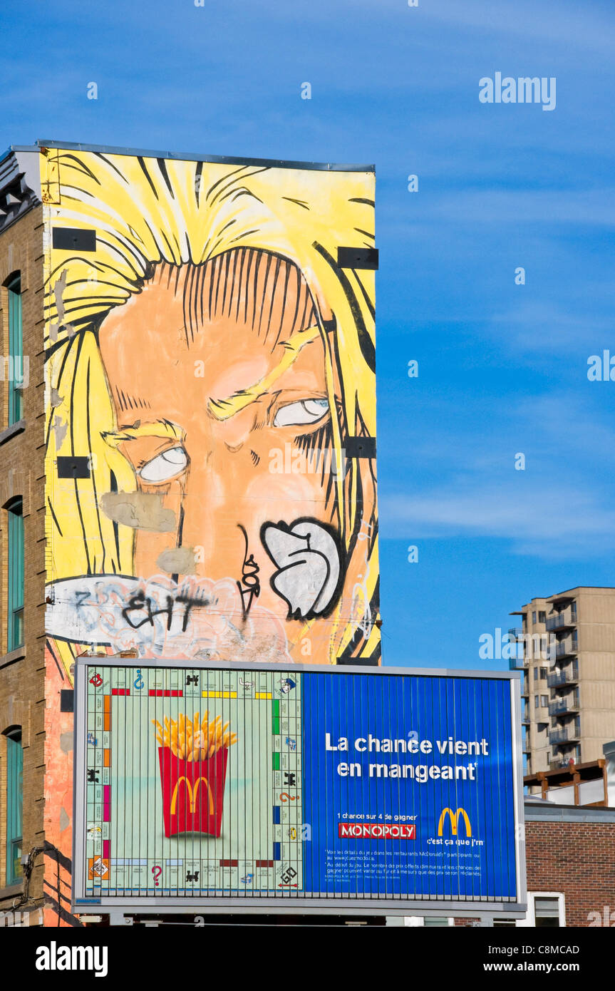 Advertising and mural painting on Sainte Catherine street downtown Montreal Canada Stock Photo