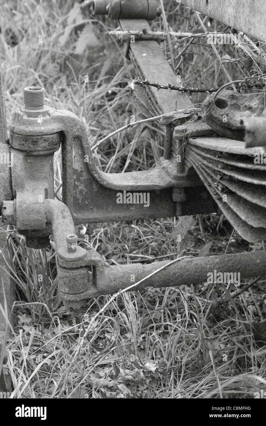 Black and white image of old trailer leaf spring suspension and steering mechanics Stock Photo