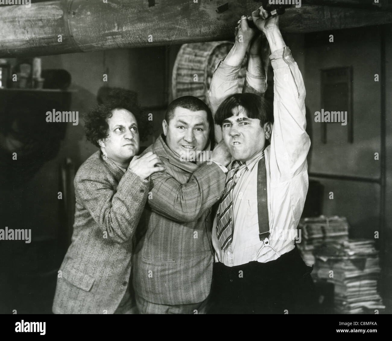 THE THREE STOOGES US vaudeville and later film comedy trio from left: Larry Fine, Curly Howard, Moe Howard Stock Photo
