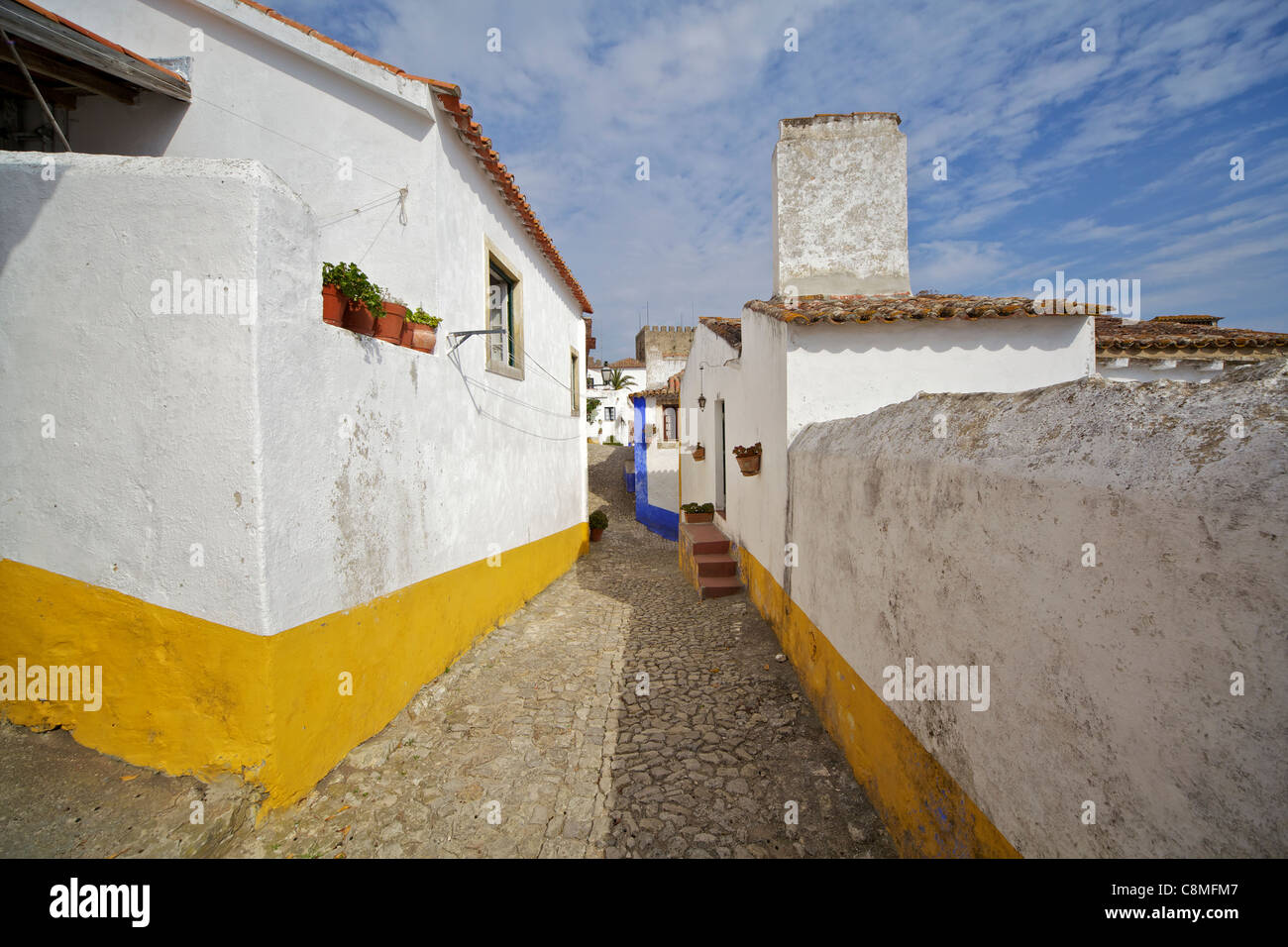 Secluded Cobblestone Street in the Medieval Village of Obidos Stock Photo