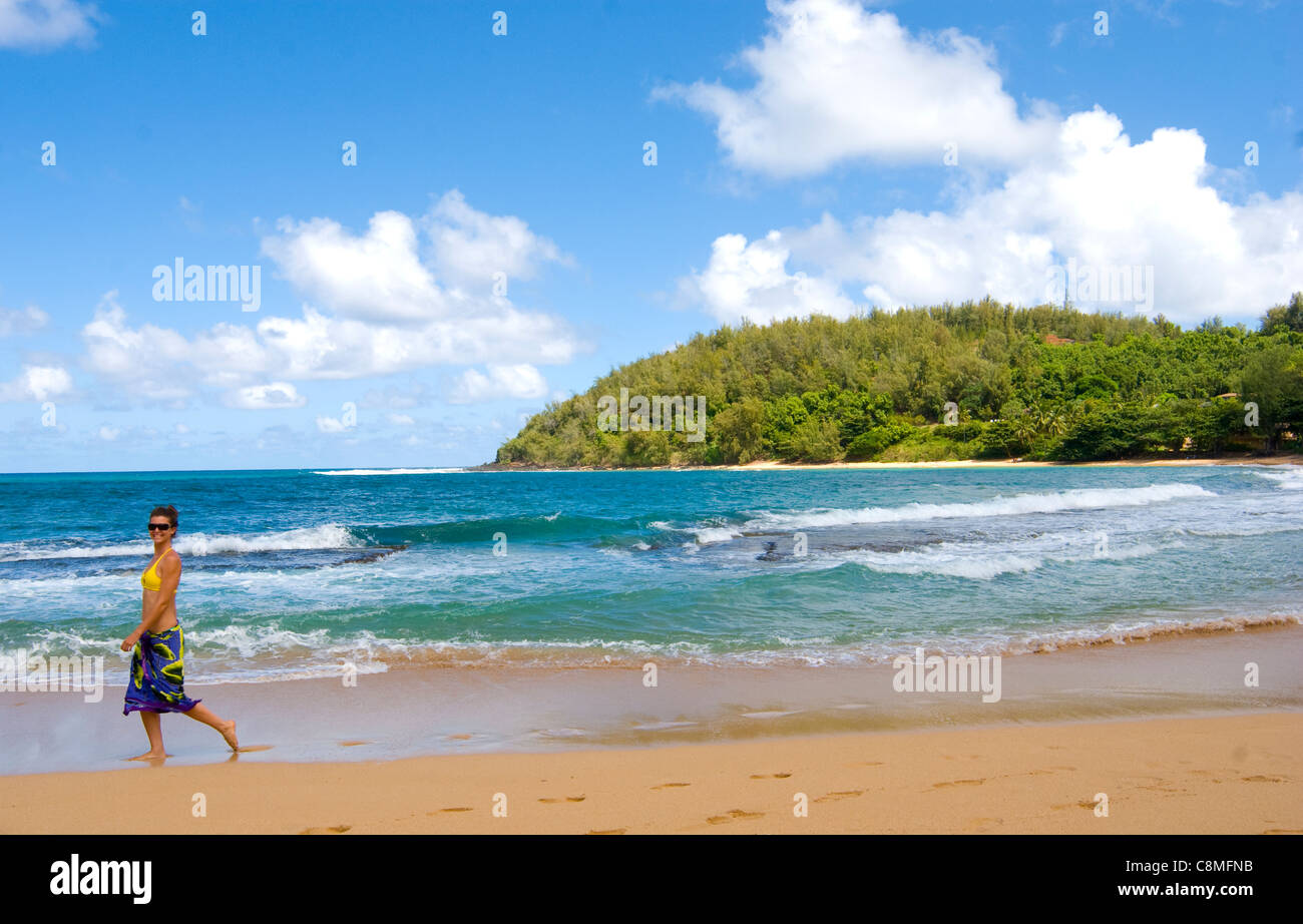 Young woman, age 21, walking and playing on Molowaa beach, north shore on the island of Kauai Stock Photo