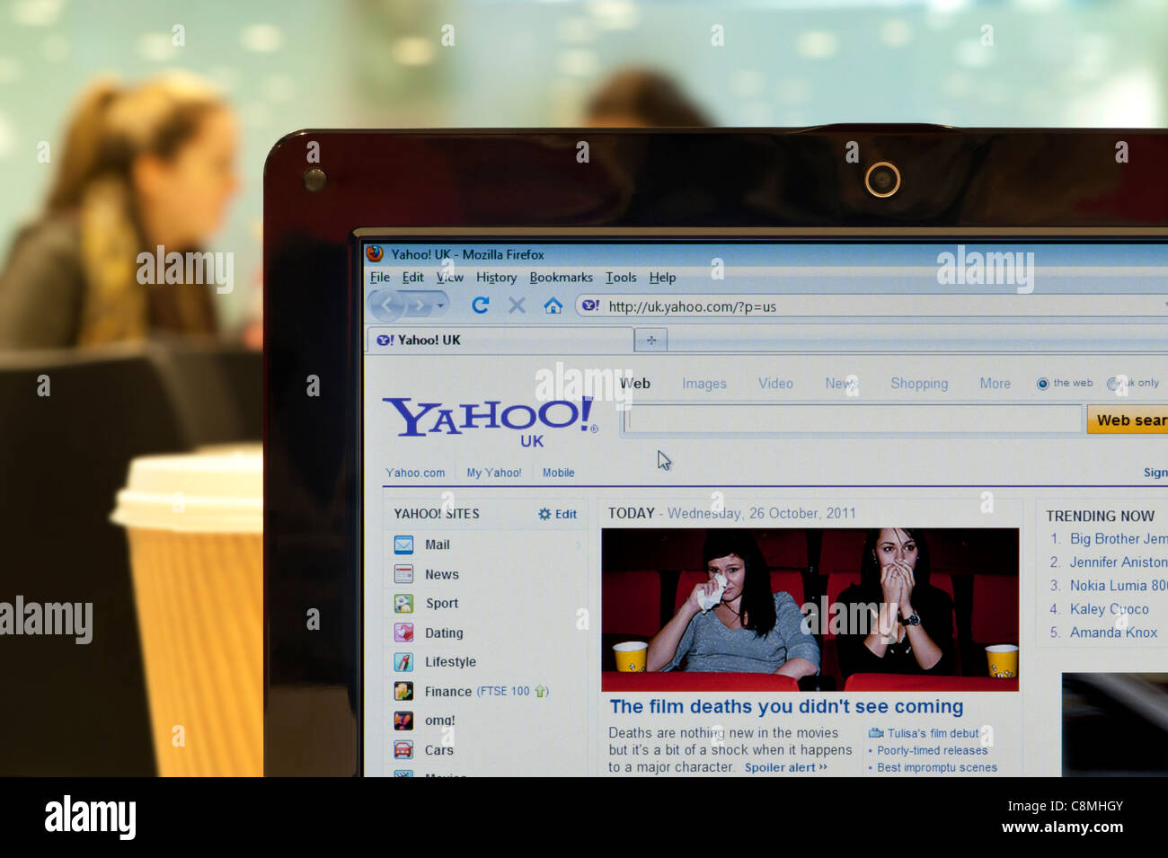 The Yahoo website shot in a coffee shop environment (Editorial use only: print, TV, e-book and editorial website). Stock Photo