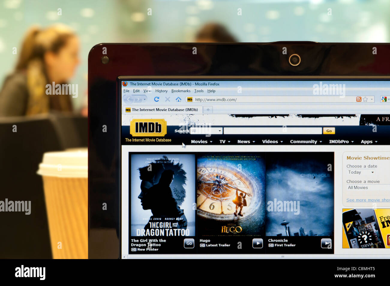 The IMDb website shot in a coffee shop environment (Editorial use only: print, TV, e-book and editorial website). Stock Photo