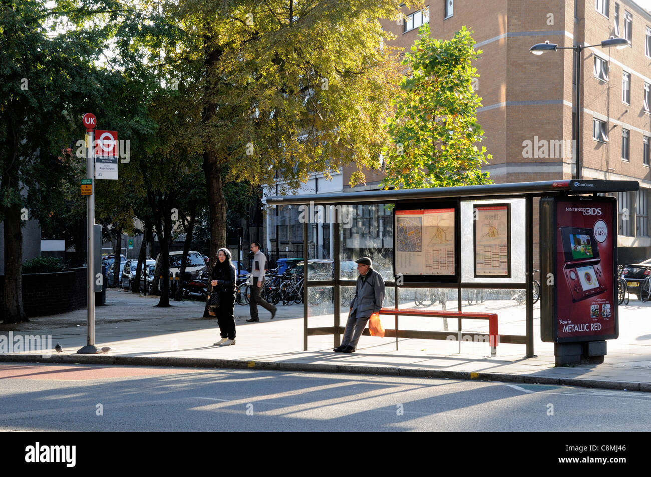 City bus stop in sunlight, Finsbury London Borough of Islington England UK Stock Photo