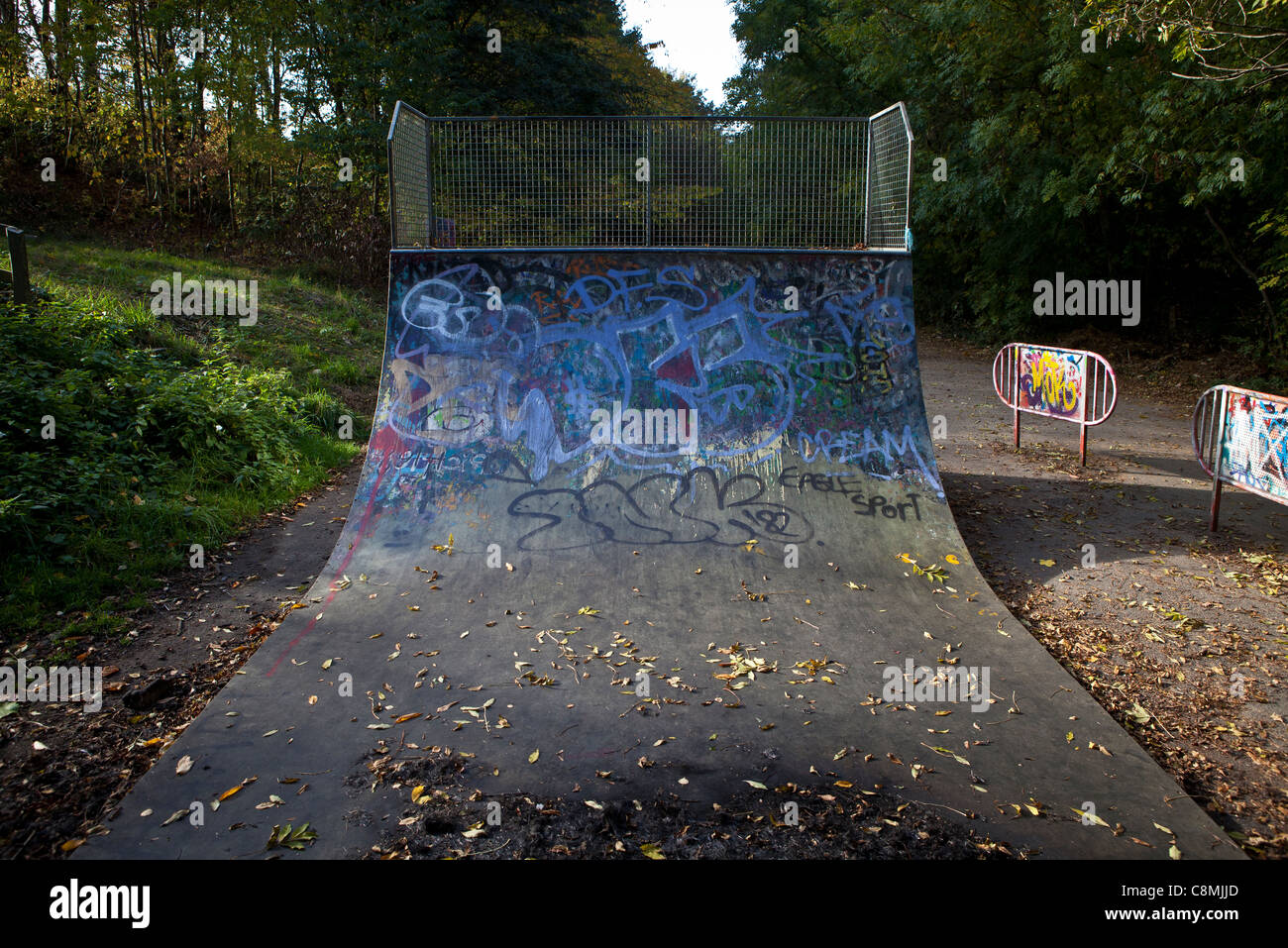 Graffiti covered skateboarding ramp Stock Photo