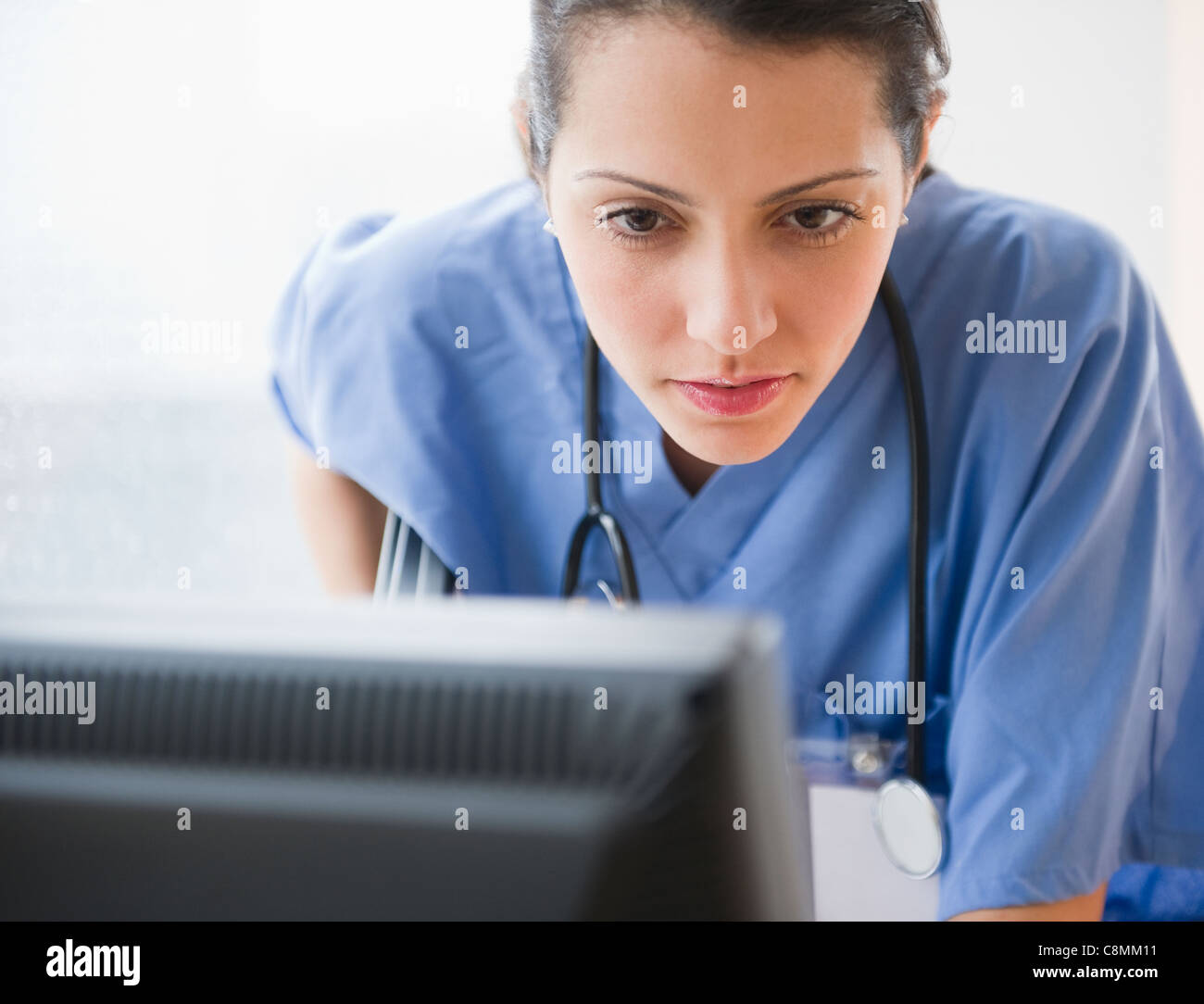 Brazilian doctor using computer Stock Photo - Alamy