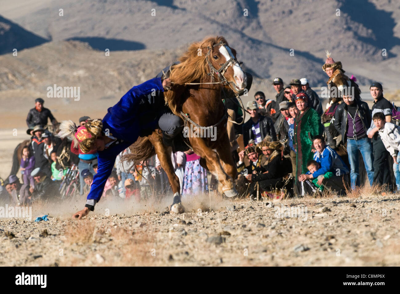 tenge alu, a traditional Kazakh sport , competition at the Eagle hunters festival in Bayan-Ölgii ,western Mongolia. Stock Photo