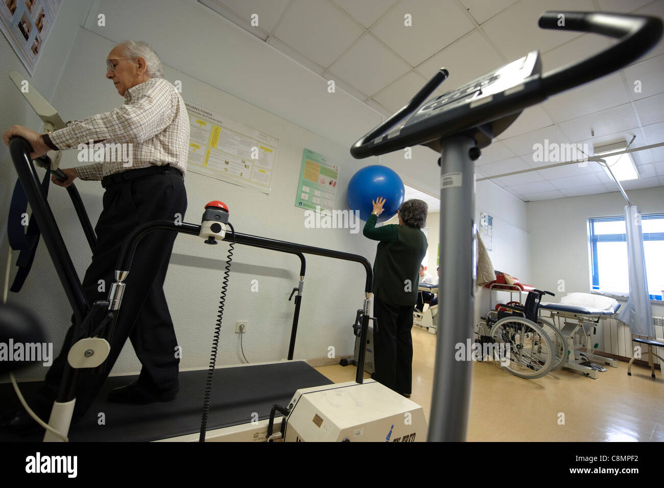 Elderly people exercising at hospital's physical rehabilitation gymn Stock Photo