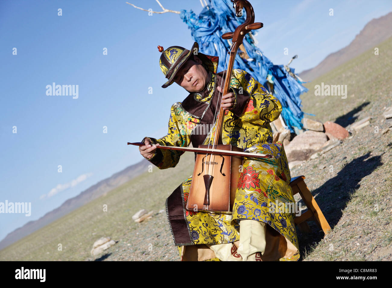 Musician playing the Morin khuur, the typical musical instrument of ...