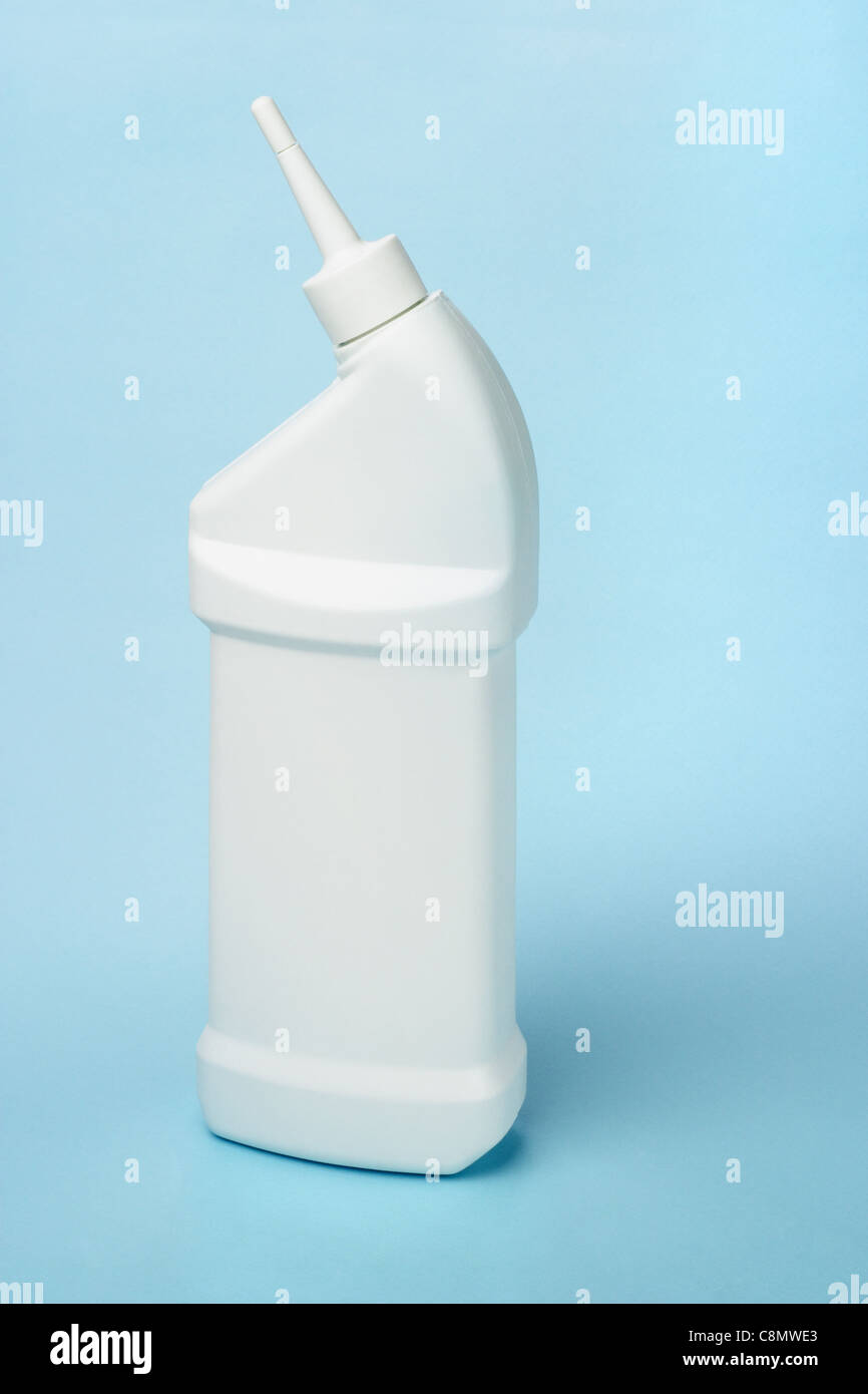 Plastic bottle of toilet bowl cleaning product on blue background Stock Photo