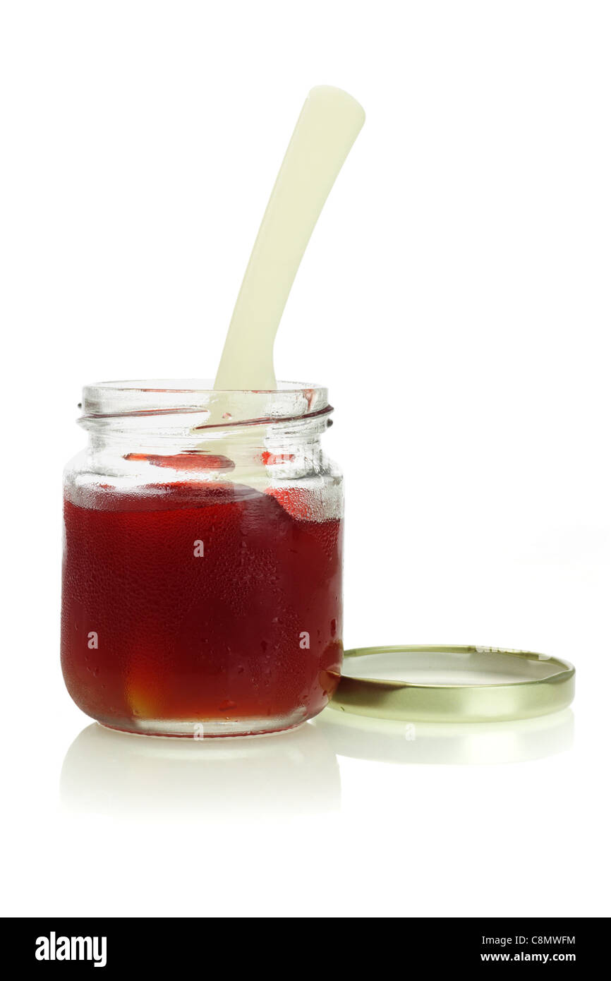 open cold and moist jar of mixed fruit jam on white background Stock Photo