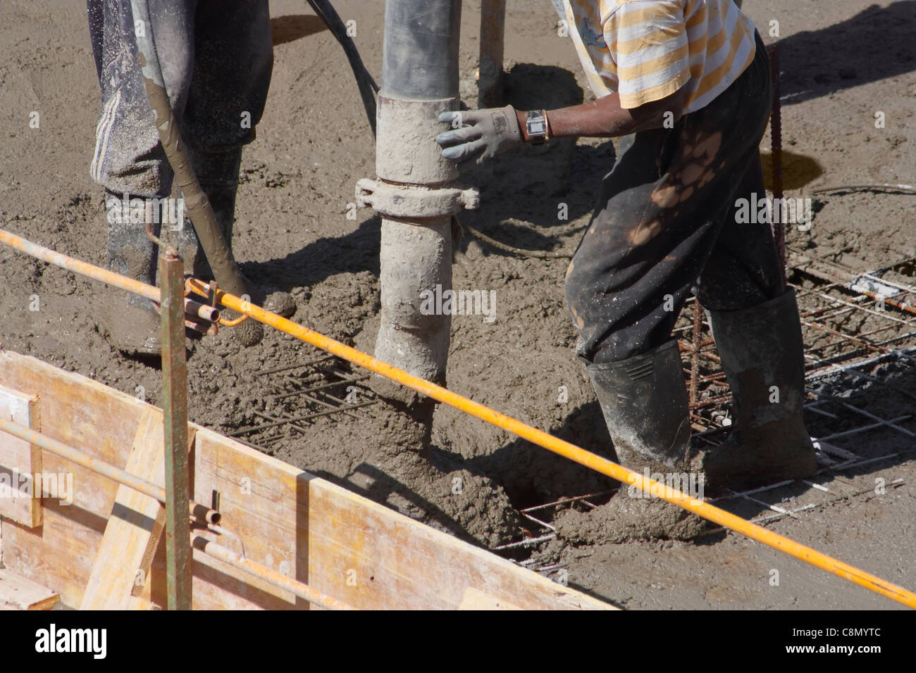 Pouring wet concrete, cement on building site Stock Photo Alamy