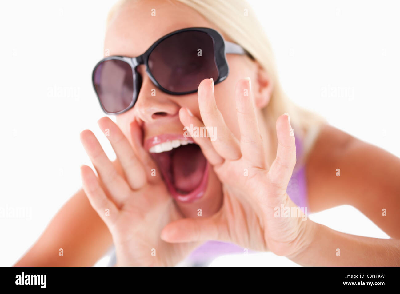 Charming woman with sunglasses in high spirits Stock Photo