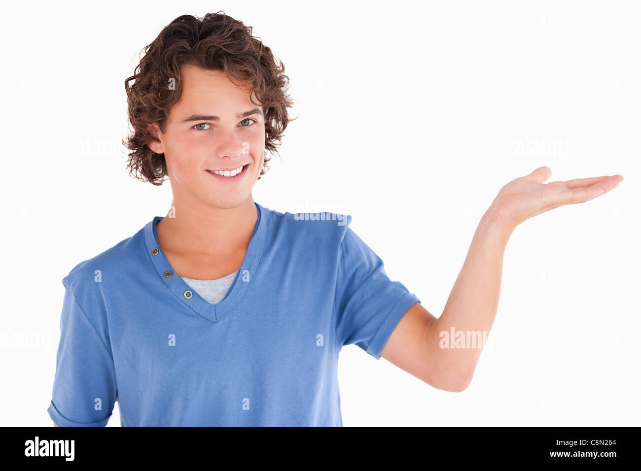 Close up of a cute guy showing copyspace Stock Photo - Alamy