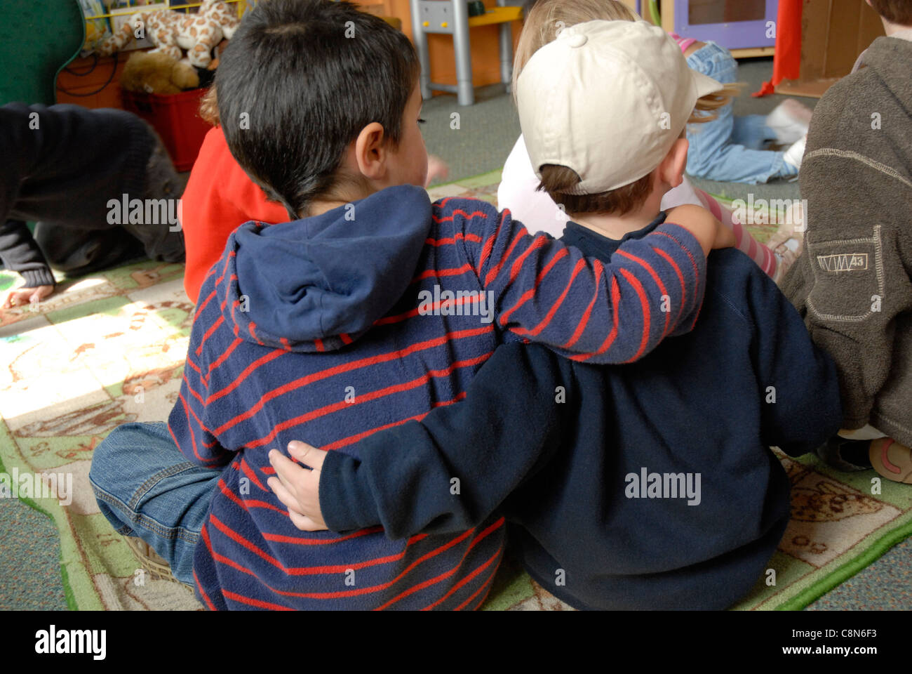 Children arms around each other hi-res stock photography and images - Alamy