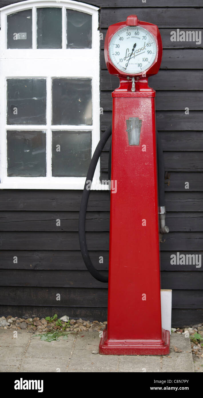 Old petrol pump in red Stock Photo