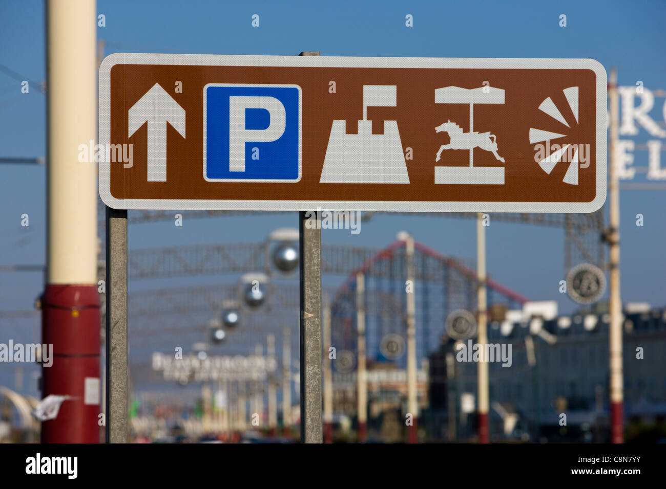 Brown tourist road sign for seaside parking, beaches, fairground and views in Blackpool, UK Stock Photo