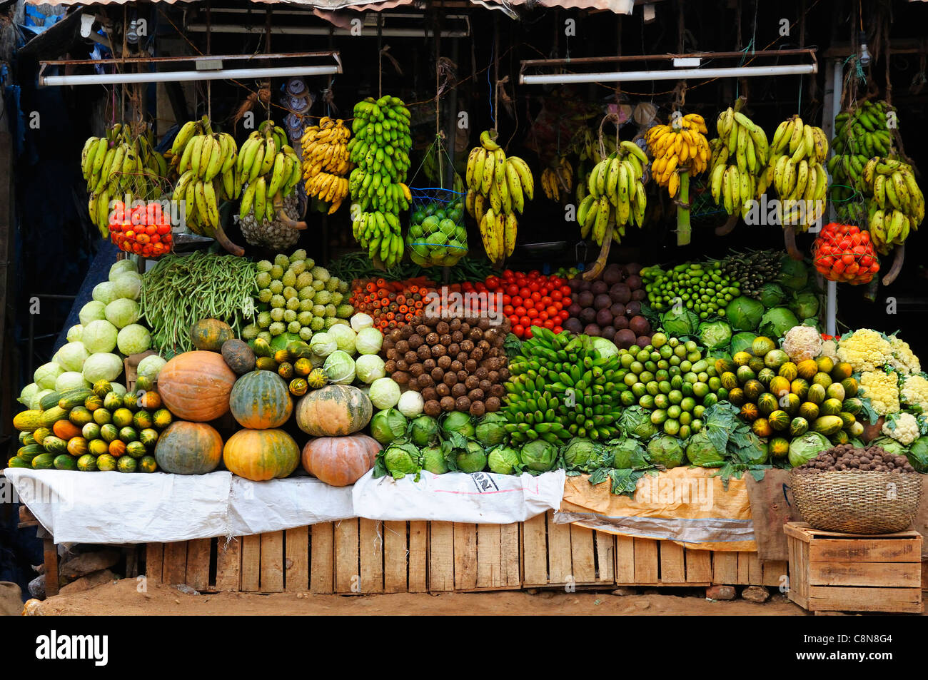 Impressive display of colourful exotic fruit and vegetables on roadside shop or stall in Cochin or Kochi, Kochin, Kerala, India Stock Photo