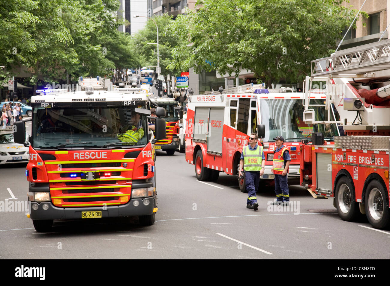 Four fire brigade engines wait in hunter street to see if a fire or danger is present,sydney,australia Stock Photo