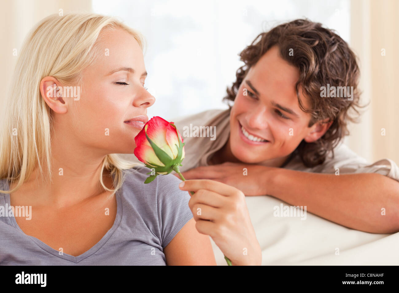 Couple with a flower Stock Photo - Alamy