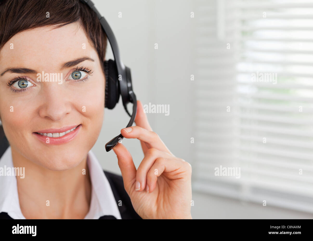 Close up smiling secretary calling hi-res stock photography and images ...