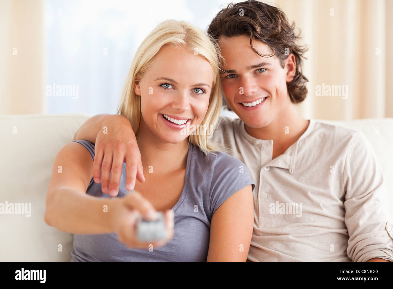 Man and woman watching tv close up hi-res stock photography and images ...