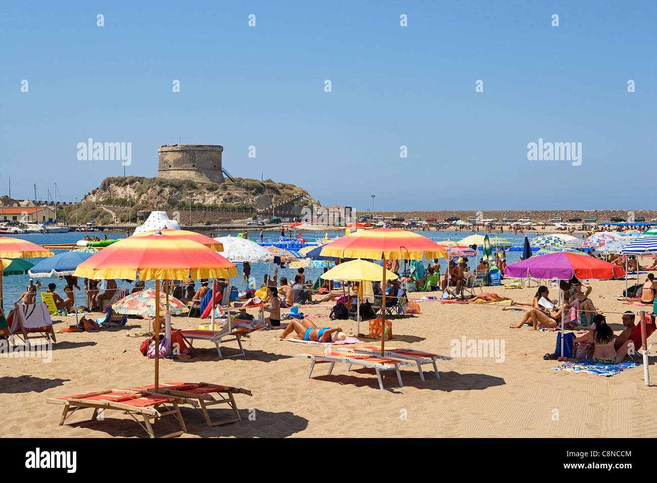 Italy, Sardinia, Bosa, Bosa Marina beach scene with fort on the promontory Stock Photo