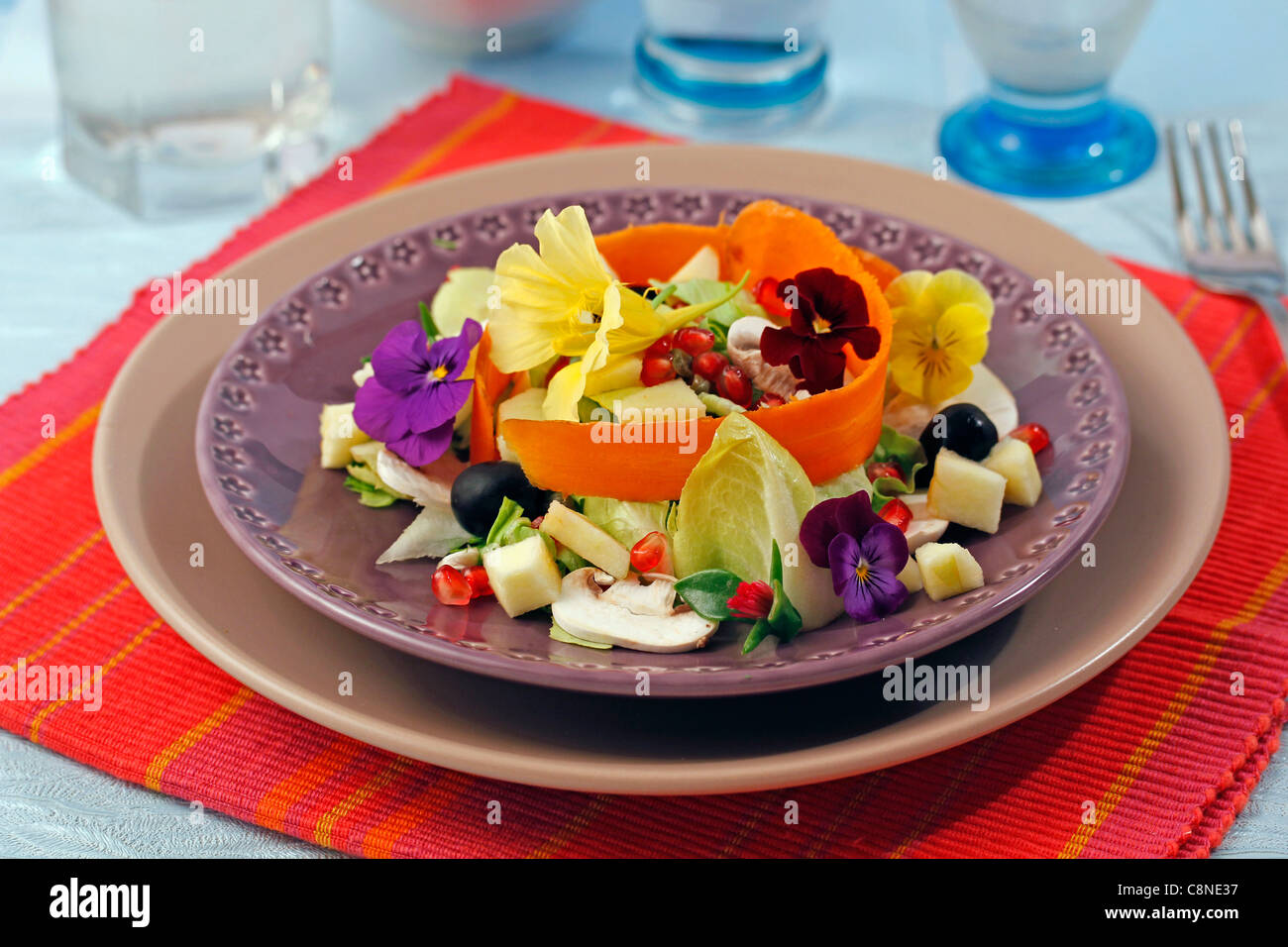 Salad with pomegranate and mushrooms. Recipe available. Stock Photo