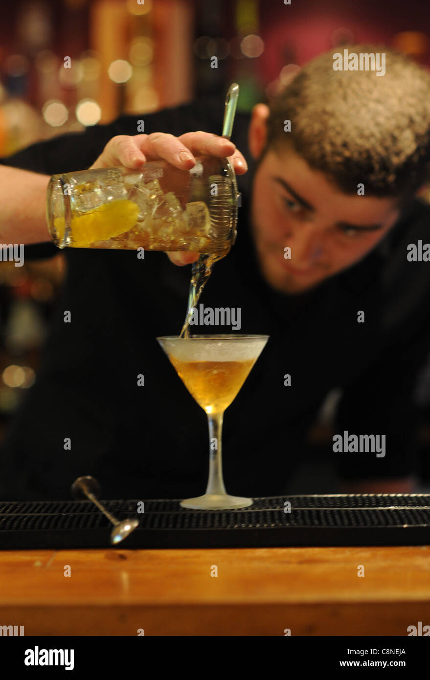 Barman making cocktails at the Twisted lemon cocktail bar and