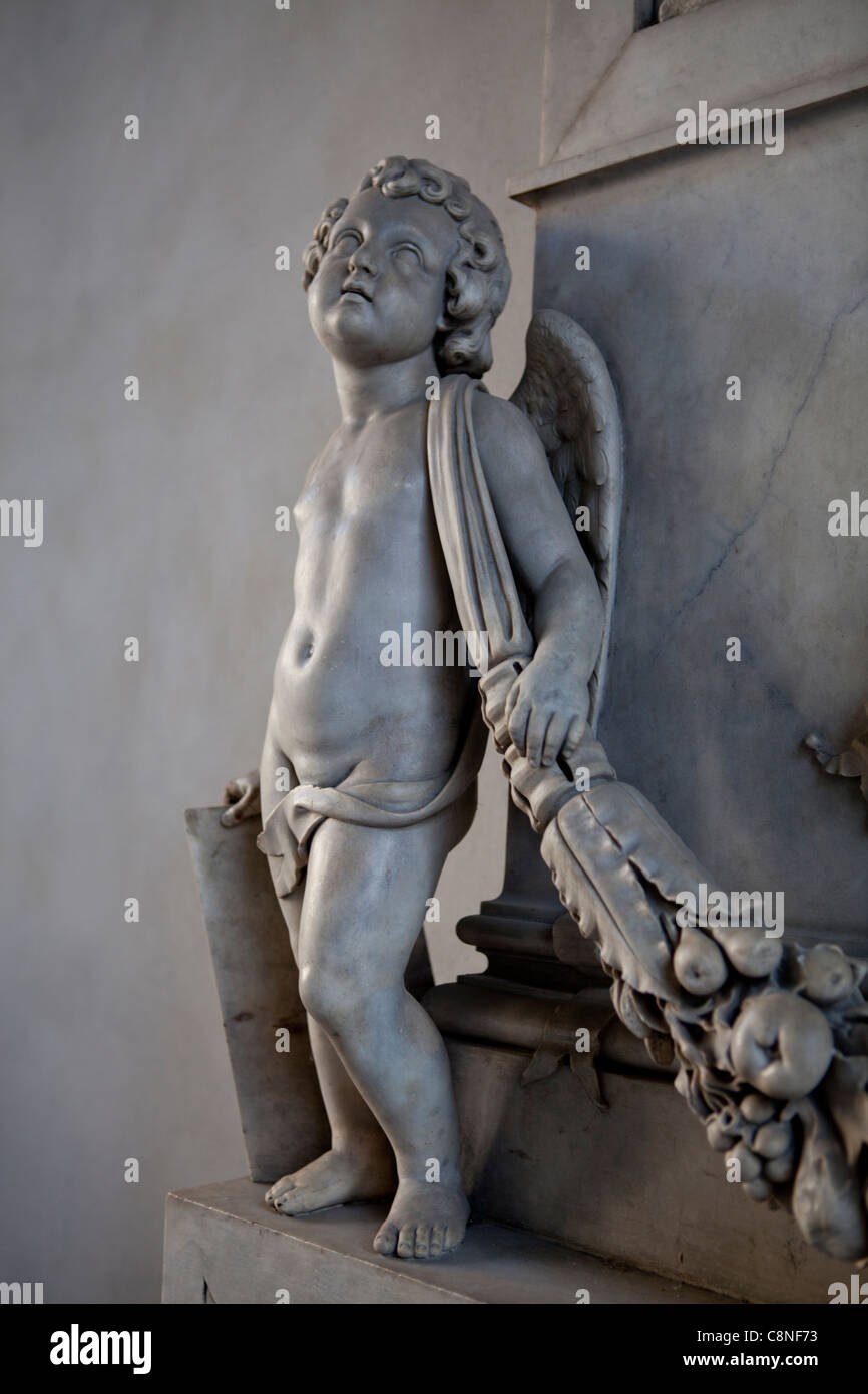 Statue of angel child realized in marble at the gate of Brera art gallery in Milan, Lombardy, Italy Stock Photo