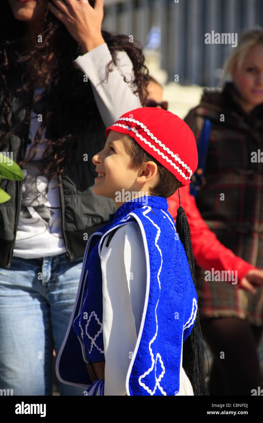 ATHENS, GREECE, 28/10/2011 - Student parade for the Greek National Holiday of joining the Second World War. Small boy dressed as 'evzonas', the Greek Persidential Guard traditional outfit. Stock Photo