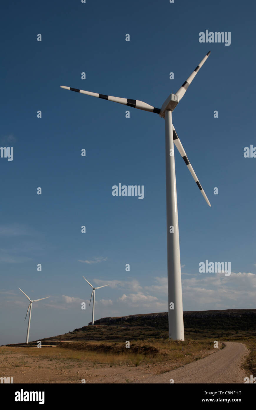 Spain, Maestrazgo, wind turbine next to country road Stock Photo