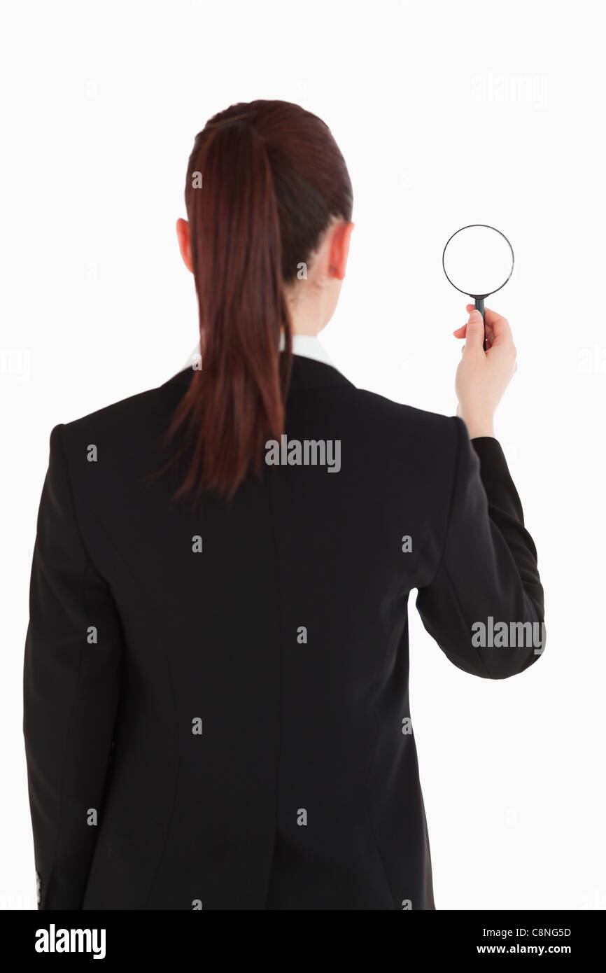 Beautiful woman in suit being back to the camera and holding a ...