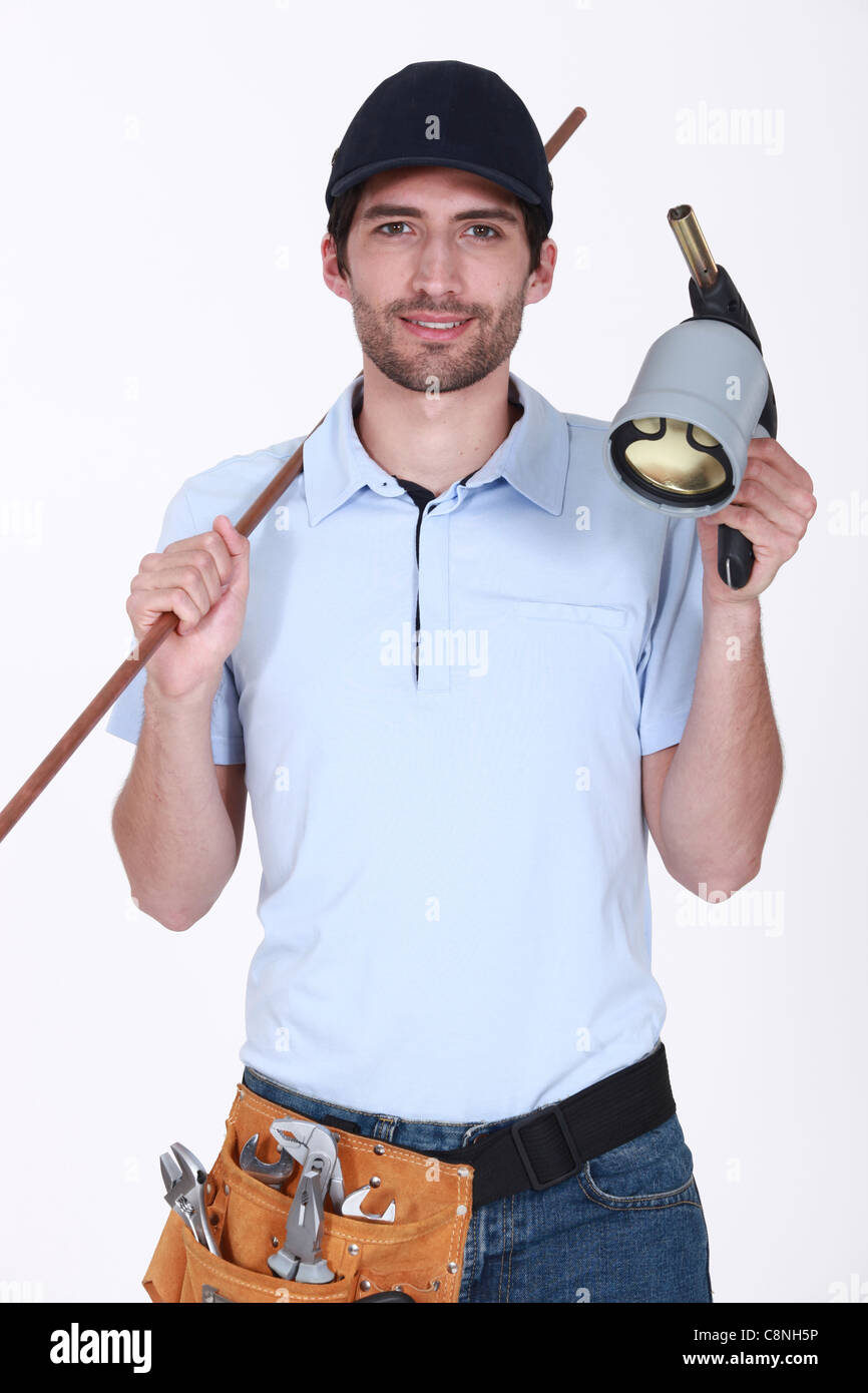 Plumber with copper pipe and blowtorch Stock Photo Alamy