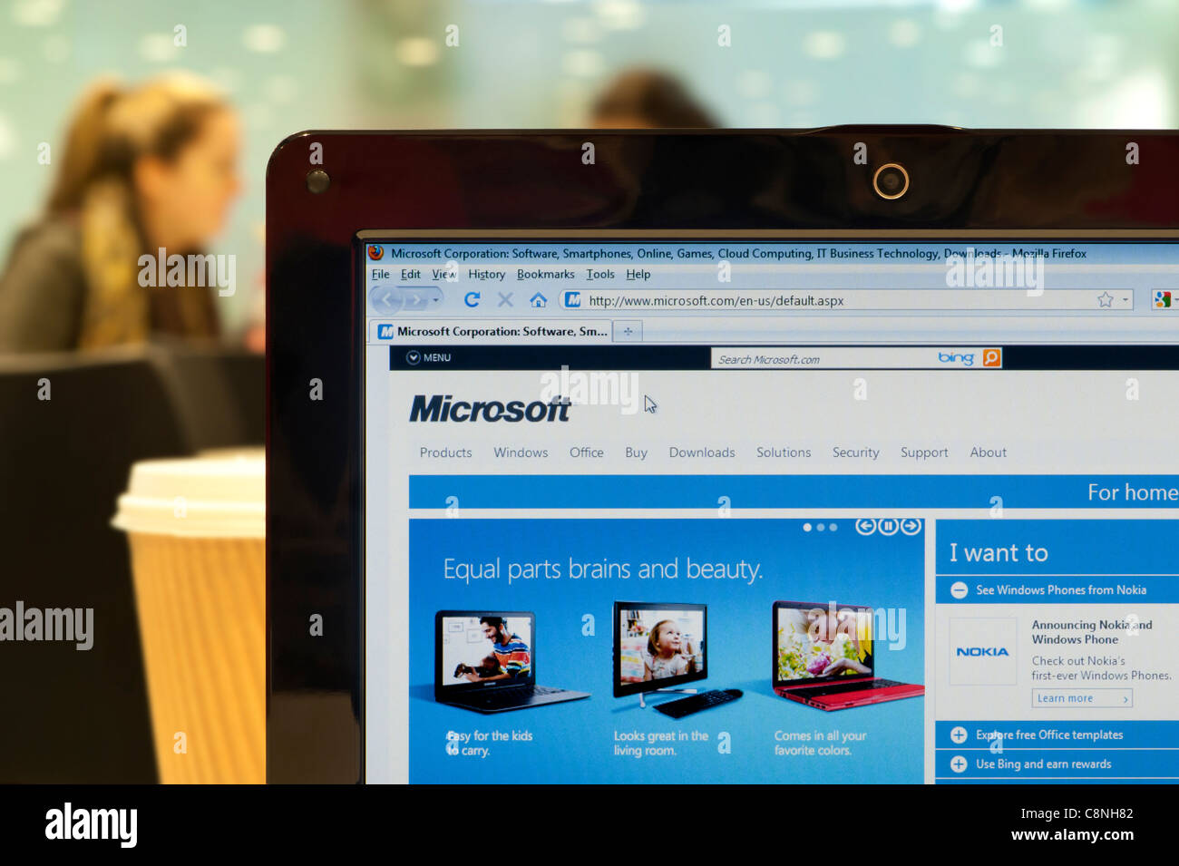 The Microsoft website shot in a coffee shop environment (Editorial use only: print, TV, e-book and editorial website). Stock Photo