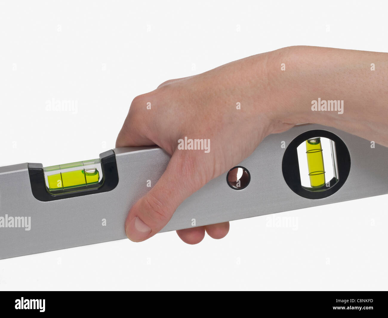 a spirit-level is hand-held Stock Photo - Alamy