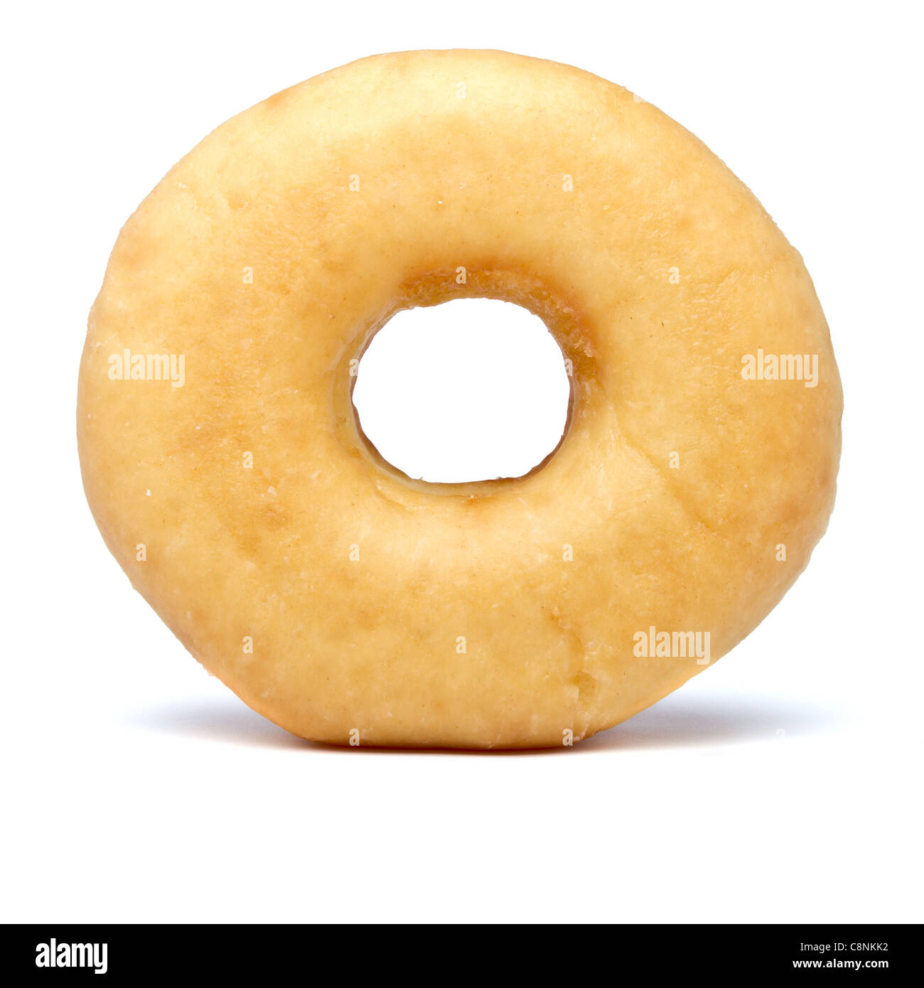 Single sugared plain doughnut from low perspective. Stock Photo
