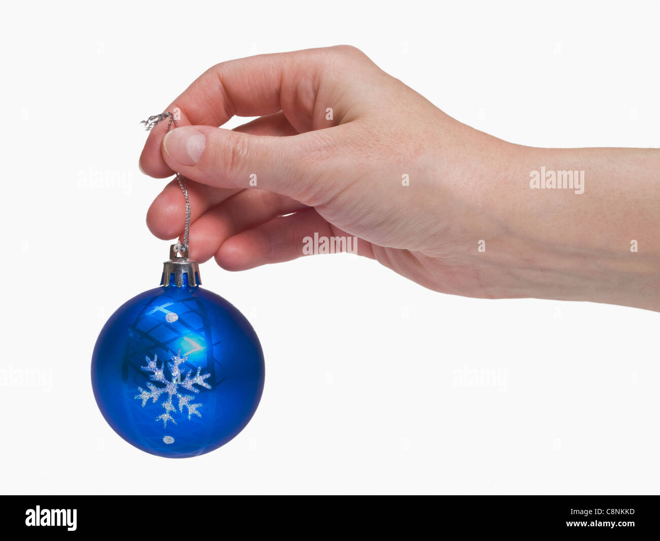 a christmas ball is hand-held Stock Photo