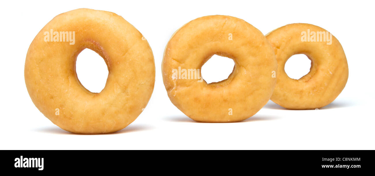 Line of 3 plain donut's isolated on white background. Stock Photo